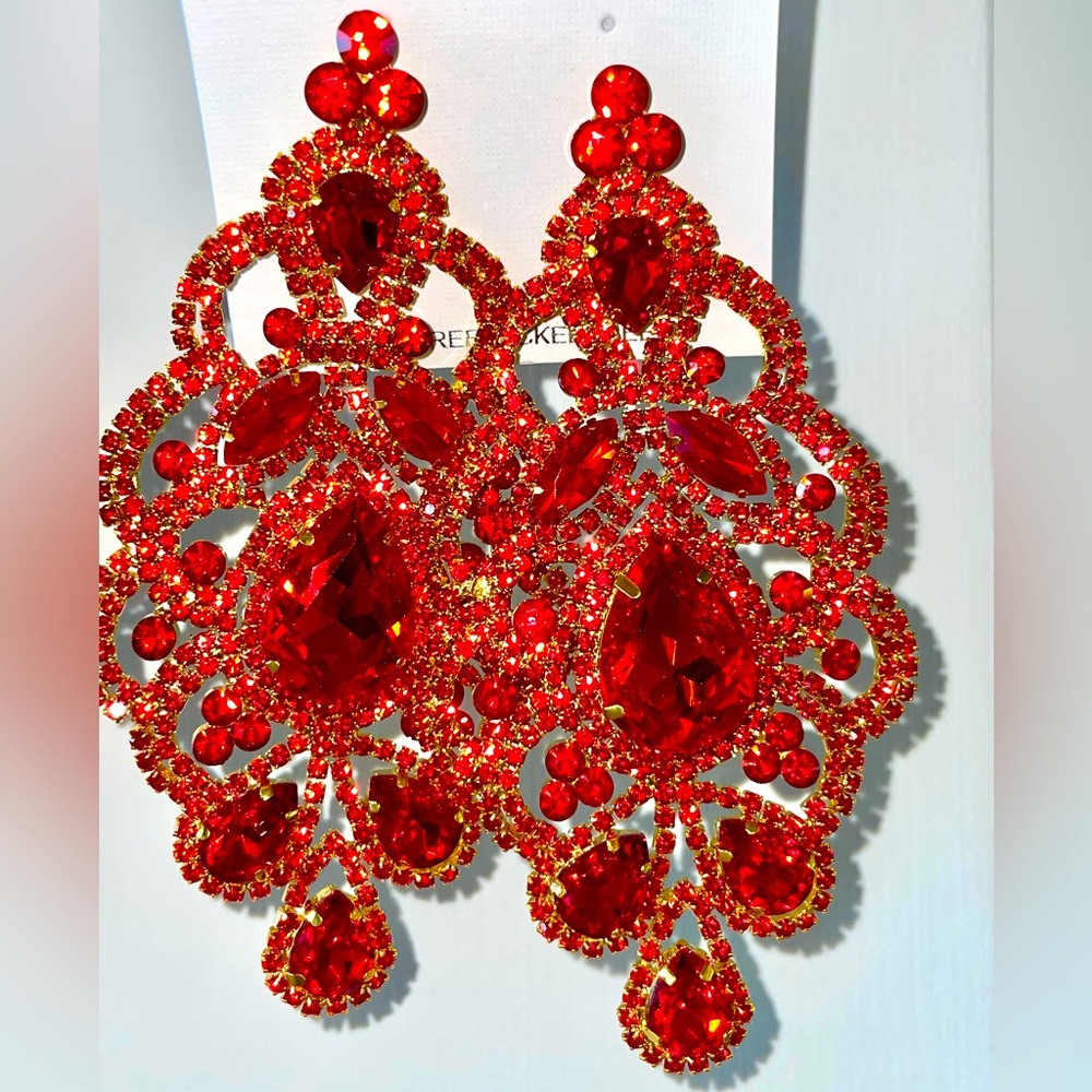 Clip on- New in bag. Dazzling Pageant -Fashion- earrings. 4.5” long.